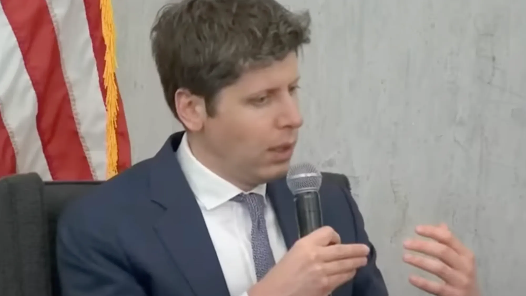 OpenAI CEO Sam Altman speaks at Federal Reserve conference on AI cost reductions and banking impact