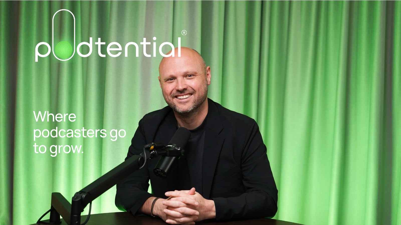 Wade Kingsley, founder of Podtential, at a podcast studio desk with microphone on launch day.