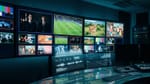 Broadcast control room displaying CTV content grid with analytics overlays and streaming metrics.