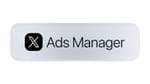 X Ads Manager logo on a silver pill badge, announced in the April 2026 platform rebuild.
