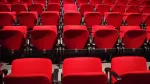 Empty red theater seats at a TV upfront presentation venue in New York City, May 2026.