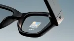 Meta Ray-Ban Display glasses showing a music player app on the in-lens display