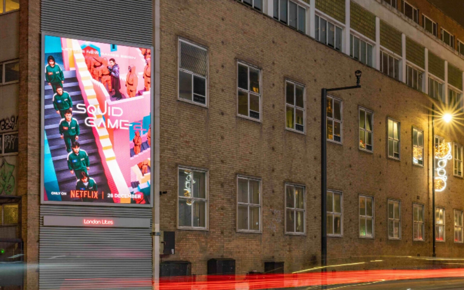London Lites digital screen displaying Netflix Squid Game advertisement in central London location