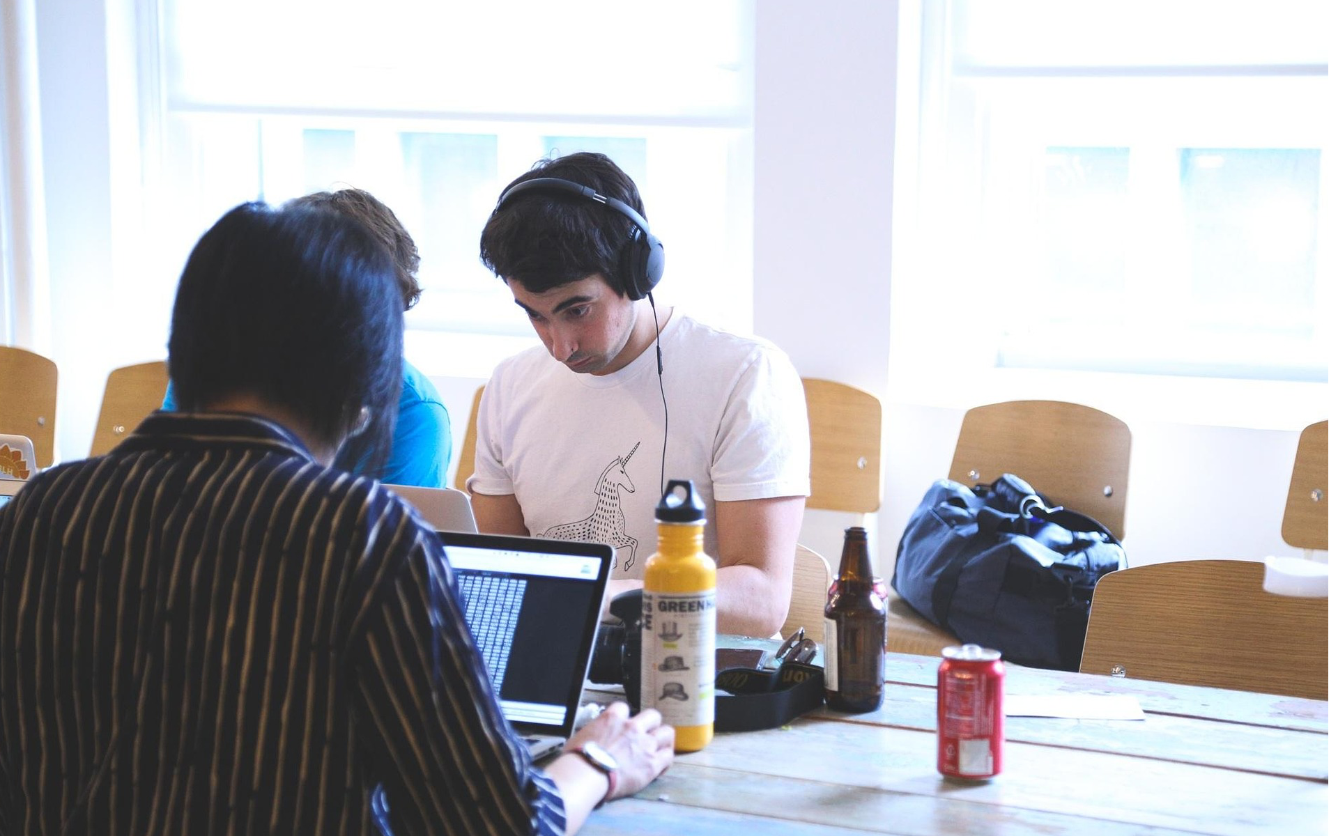 Marketing professionals collaborate on AI-powered campaign strategies in modern workspace environment.