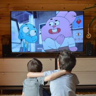 Children watching Connected TV at home, showcasing how new TV measurement tech tracks viewing across modern platforms.