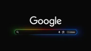 Google homepage displaying new AI Mode button with colorful gradient design in search bar interface.