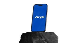 Aryel app on smartphone resting on rock, acquired by Onetag for programmatic advertising.
