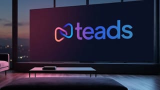 Teads logo on a smart TV home screen in a dark modern living room at dusk.