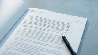 Microsoft data protection addendum open on desk with 30 days annotation circled in pencil