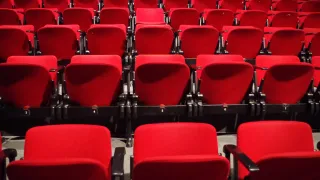 Empty red theater seats at a TV upfront presentation venue in New York City, May 2026.