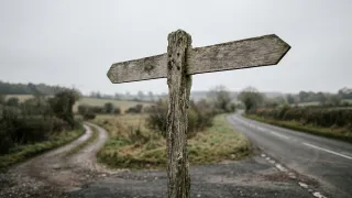 Blank signpost at a road fork, symbolizing unresolved EU cookie consent regulation.