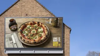 Marmite 'Love It. Hate It. Cook With It.' OOH billboard with jalapeno pizza, UK 2026