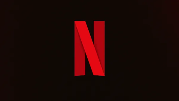 Netflix logo on dark background representing streaming platform's expansion into programmatic advertising partnerships.