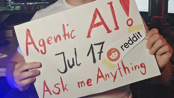 IBM specialist promotes agentic AI Reddit AMA with handwritten sign at tech workspace setup