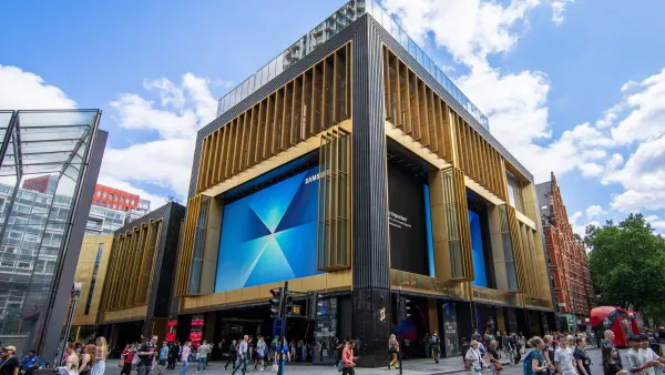 Large digital screens display Samsung ads on Outernet London's Now Building facade in central London.