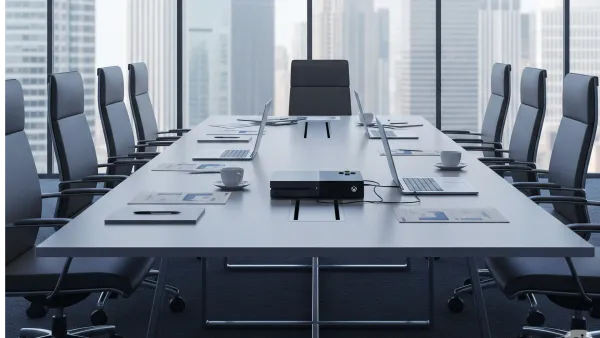 Empty Microsoft boardroom with Xbox console symbolizing 9,000 employee layoffs in gaming division