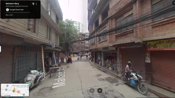 Street View image of Mahakavi Marg in Kathmandu, Nepal showing local shops and traditional architecture.