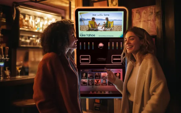 Digital out-of-home advertising screen displays Lake Tahoe tourism ad in casual dining venue setting.