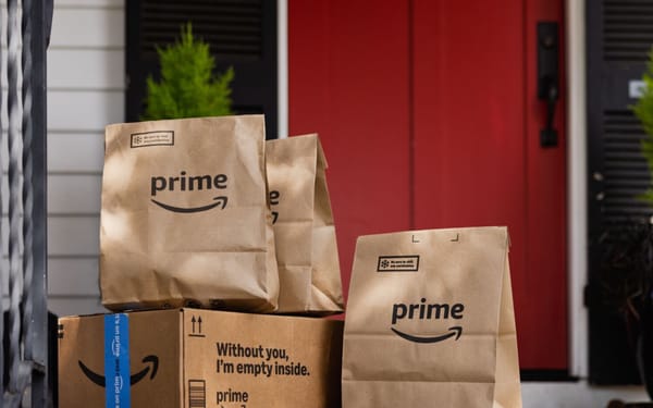 Amazon Prime grocery bags and boxes delivered to residential doorstep with fresh food items