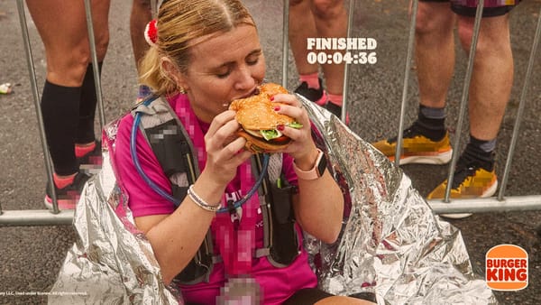 Marathon runner eating Burger King burger at finish line, London Marathon 2026