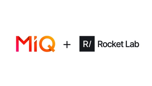 MiQ and Rocket Lab logos side by side announcing the acquisition deal, April 2026.