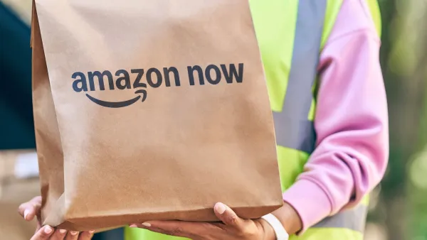 Amazon Now delivery bag handed to customer by driver in high-visibility vest