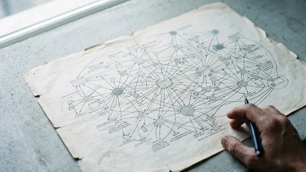 Hand and pen over aged internet network map on concrete, representing Google AI search agents